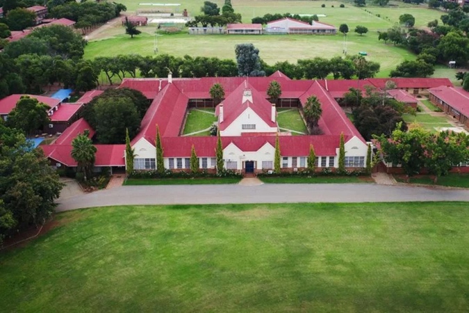 Aerial view of Potchefstroom High School for Boys — Cape Dutch architecture, red roofs, surrounded by sports fields